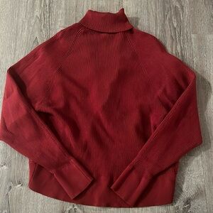 Open back turtle neck sweater